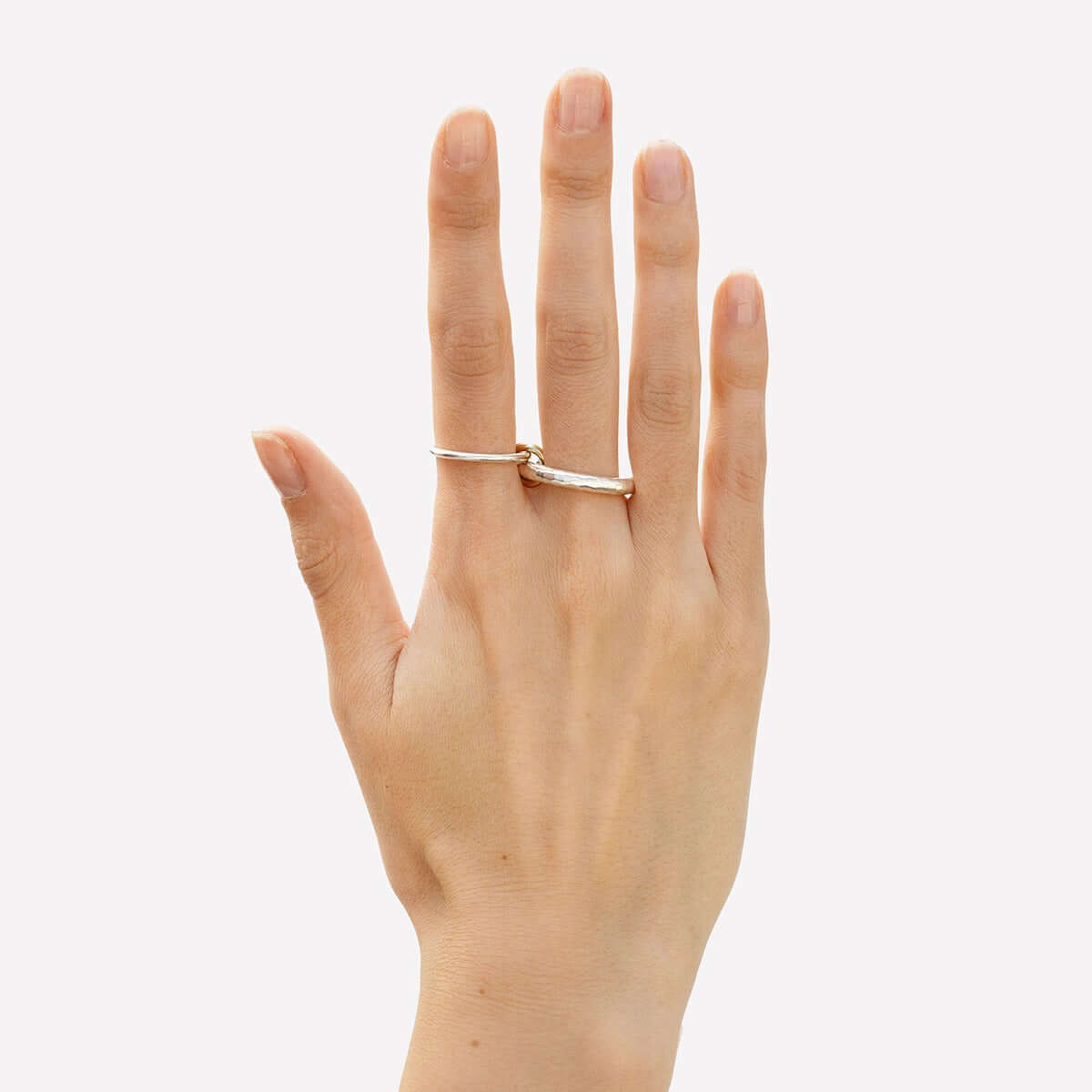 Model wearing an 18K gold double-circle interlocking ring, showcasing affordable everyday jewelry for layering.