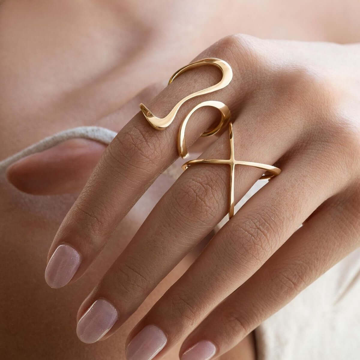 Elegant 18K gold line design rings showcased on a hand, perfect for daily wear and affordable layering jewelry.